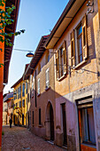 City Road with Old Houses in a Sunny Day in Arzo, Ticino, Switzerland.