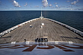 A couple dances on the bow deck of cruise ship Vasco da Gama (Nicko Cruises), Baltic Sea, near Sweden, Europe