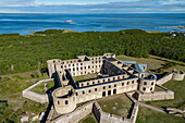 Aerial view of Borgholm Castle with expedition cruise ship World Voyager (nicko cruises) in the distance, Borgholm, Oland, Sweden, Europe