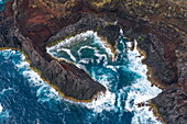 Aerial view of bay in rugged coastline at Farol da Ponta da Barca lighthouse, Santa Cruz da Graciosa, Graciosa Island, Azores, Portugal, Europe