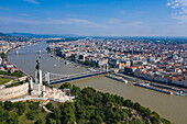 Aerial view of Gellert Hill and Citadel with Statue of Liberty with river cruise ship Excellence Empress (Travel Agency Mittelthurgau) docked on Danube River, Budapest, Pest, Hungary, Europe