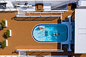 Aerial view of couple relaxing in pool on sun deck of river cruise ship Excellence Empress (travel agency Mittelthurgau) on Danube river, Bratislava, Bratislava, Slovakia, Europe