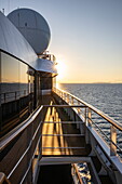 Reflection in windows aboard expedition cruise ship World Explorer (Nicko Cruises) at sunrise, near Isthmia, Peloponnese, Greece, Europe