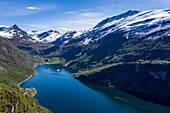 Aerial view of expedition cruise ship World Voyager (nicko cruises) in the Geirangerfjord seen from the viewpoint near Eagle&#39;s Bend, Geiranger, Møre og Romsdal, Norway, Europe