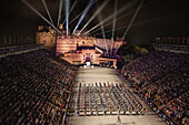 View across Edinburgh Castle Esplanade with lightshow and The Massed UK Military Bands performing at the Royal Edinburgh Military Tattoo 2022, Edinburgh, Scotland, United Kingdom, Europe