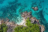 Aerial view of beach in a small bay with granite rocks, Curieuse Island, Seychelles, Indian Ocean