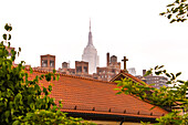 View from High Line Park over the rooftops of Manhattan to the Empire State Building in the fog, New York, USA