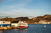 View of the harbor with a ship in the foreground, Bodö; Nordland, Norway, Europe