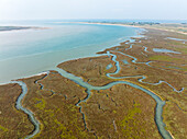 Salt marshes in Havre de St Germain sur Ay bay at high tide, spring, aerial view