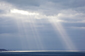 Rays of light over the sea at Erquy, Brittany