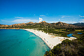 Sandy beach and mountains, Plage de lOstriconi, near LÎle-Rousse, Haute-Corse department, Corsica, Mediterranean Sea, France