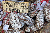 Display with salamis at the Saturday market in Pernes-les-Fontaines, Vaucluse, Provence-Alpes-Côte d&#39;Azur, France