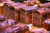 Detail of delicious pies for sale in one of the many gourmet shops and restaurants in Les Halles de Lyon Paul Bocuse, Lyon, Lyon, Rhone, France, Europe