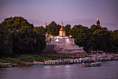 Fishing and sightseeing boats on the Ayeyarwady (Irawaddy) River with temples at dusk, Old Bagan, Nyaung-U, Mandalay Region, Myanmar, Asia