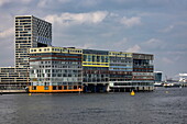 Unique modern architecture on the Amstel River, Amsterdam, North Holland, The Netherlands, Europe