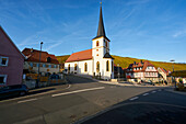 Church in the wine town of Escherndorf amidst the vineyards on the Volkacher Mainschleife, Unterfranken, Bavaria, Germany