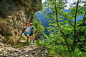 Man and woman hiking on an insured path, Monti del Sole, Belluneser Höhenweg, Dolomites, Veneto, Venetia, Italy