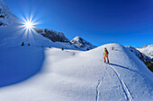 Woman on ski tour ascending to Hauserspitze, Hauserspitze, Tuxertal, Zillertal Alps, Tyrol, Austria