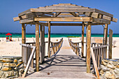 Wooden walkway and pavilion to beach in whitewashed village of Conil de la Frontera on coast of Costa de la Luz, Andalucia, Spain