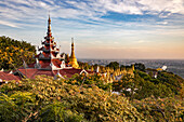 View of the city from the Burmese Su Taung Pyae Pagoda on Mandalay Hill at sunset, Myanmar