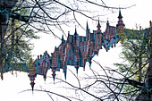 Double exposure of the spires and towers of the Brugse Vrije, a old court building in Bruges, Belgium.
