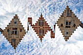 Double exposure of a stepped gable house in Bruges, Belgium.