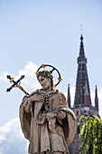 Statue of a saint posted at the beginning of the Wollestraat in Bruges, Belgium.
