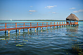Jetty leading into the clear waters of Bacalar Lagoon, Quintana Roo, Yucatán, Mexico, North America, Latin America