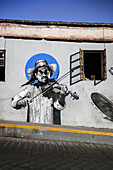 traditionally dressed native plays violin on a mural, city of Oaxaca de Juárez, state of Oaxaca, Mexico, North America, Latin America