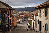 on the way in the steep streets of the old town of San Cristóbal de las Casas, Central Highlands (Sierra Madre de Chiapas), Mexico, North America, Latin America