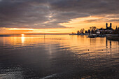 Sunset on the shore of Lake Constance from Friedrichshafen with the Castle Church, Baden-Württemberg, Germany
