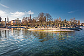 View from the harbor pier to the Stadtgarten on the shore of Lake Constance, Konstanz, Baden-Württemberg, Germany