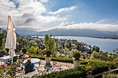 View from the terrace of the traditional hotel `Das Tegernsee` over the Tegernsee, Upper Bavaria, Bavaria, Germany