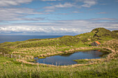 Small loch Loch Leum nam Bradh in the north east of the Trotternish Peninsula, Isle of Skye, Highlands, Scotland, UK