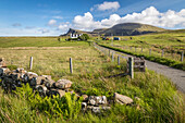 Lone farm in the north of the Trotternish Peninsula, Isle of Skye, Highlands, Scotland, UK