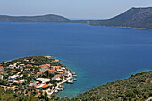 Fishing village of Steni Vala on the east coast of Alonissos island, with Perista island in the background, Northern Sporades, Greece