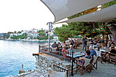 Terrace of Taverna Bourtzi on Bourtzi peninsula, town, Skiathos island, Northern Sporades, Greece