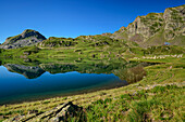 Mountain lake Lac Gentau with hut Refuge d&#39; Ayous, Vallee d&#39; Ossau, Pyrenees National Park, Pyrenees, France