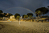 Morning mood with rainbow at Platja Palmira beach, Paguera, Mallorca, Spain