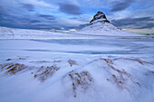 Mount Kirjufell in a wintry setting in Iceland, Iceland.