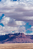 The Vermilion cliffs in Arizona under a cloudy sky.