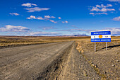 Welcome sign on the gravel road to the Republic of Argentina on the border with Chile, Patagonia, South America
