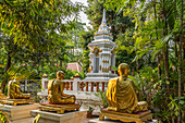Golden statues of monks in the garden of the Buddhist temple complex Wat Phra Singh, Chiang Mai, Thailand, Asia