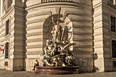 Fountain sculpture Die Macht zu Land, Michaelertrakt of the Hofburg in Vienna, Austria, Europe