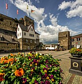 Rheinfels Castle, floral decorations and flags in the entrance area of the castle, St. Goar, Upper Middle Rhine Valley, Rhineland-Palatinate, Germany