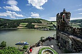 View of the Rhine Tower, the fountain terrace and the ship landing stage, where tourists leave an excursion boat towards the castle, Rheinstein Castle, Trechtingshausen, Upper Middle Rhine Valley, Rhineland-Palatinate, Germany
