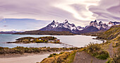 Panoramic view of jetty and island with hotel on Lago Pehoe with a view of the Torres del Paine massif, Chile, Patagonia, South America