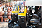 Pune, Maharashtra, India, Rickshaw parked next to clay pot vendors