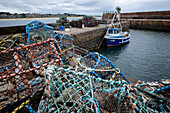 View of North Berwick harbor with lobster pots in the foreground, East Lothian, Scotland, United Kingdom