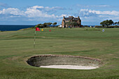 View of the clubhouse at Winterfield Golf Club with pot bunker in foreground, Dunbar, East Lothian, Scotland, United Kingdom